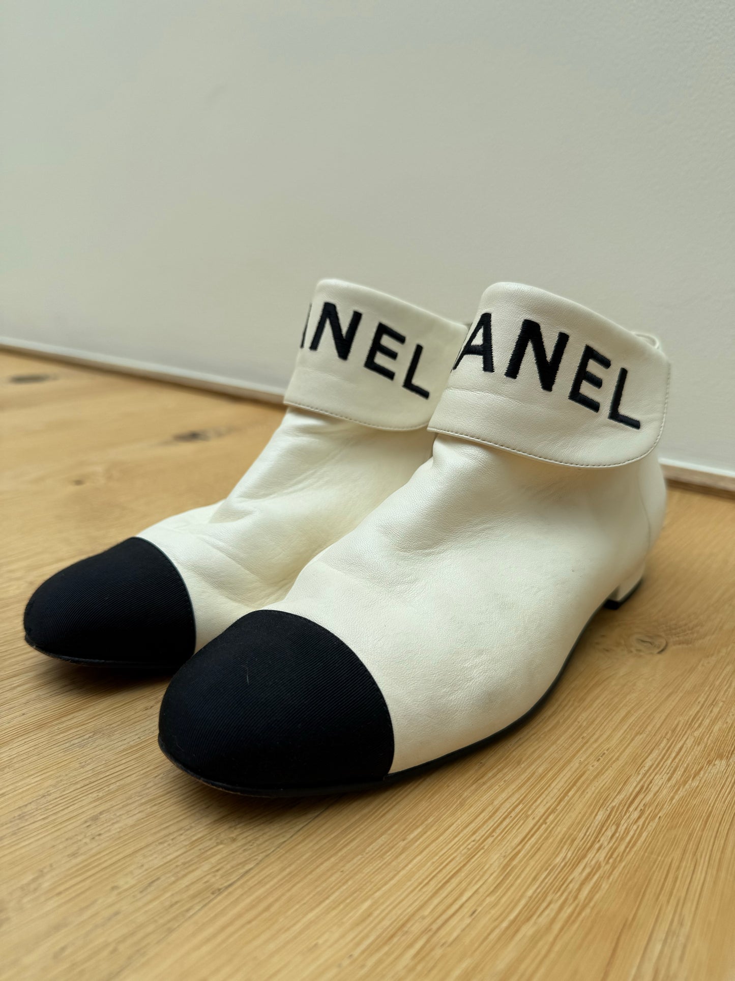 CHANEL logo boots