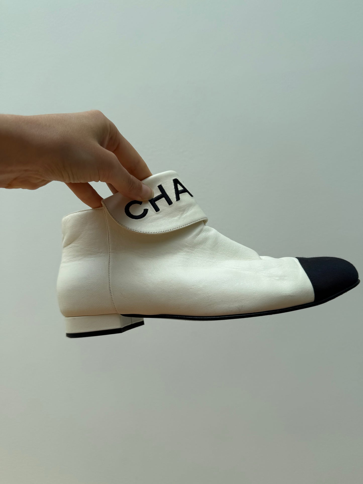 CHANEL logo boots