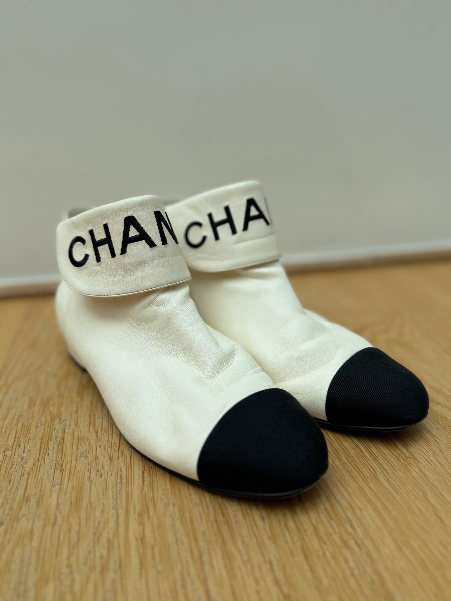 CHANEL logo boots